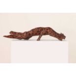 An African root carving of a leopard,