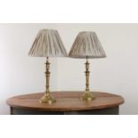 A pair of French Empire-style brass table lamps,