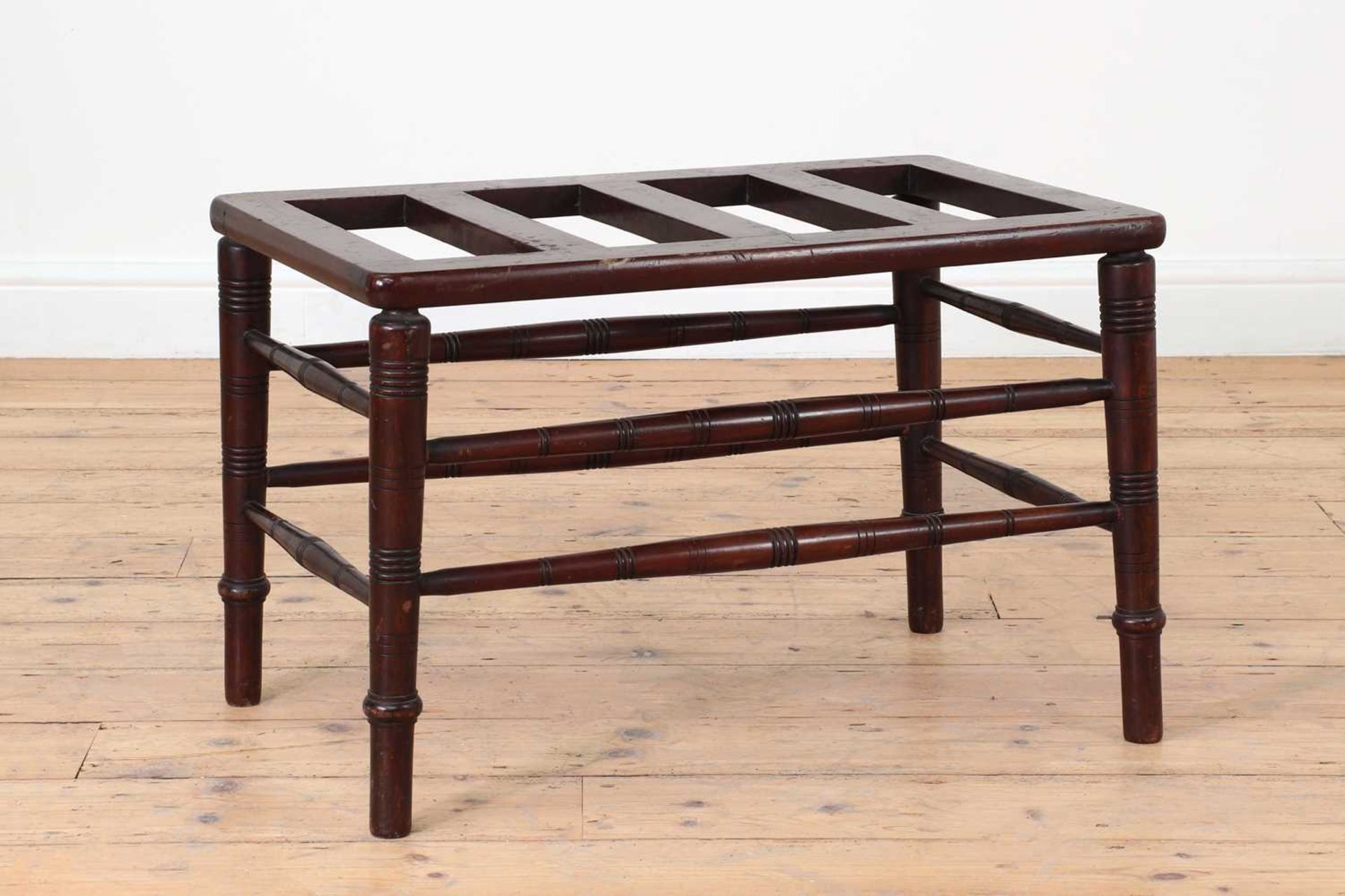 A Victorian Aesthetic period walnut luggage rack,