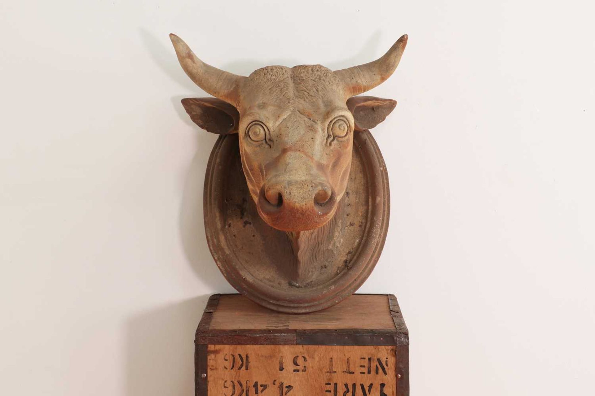 A large unglazed stoneware bull's head,