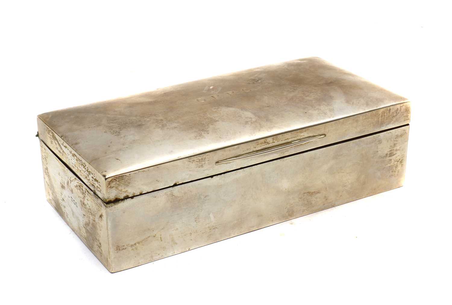 A silver cigarette box,