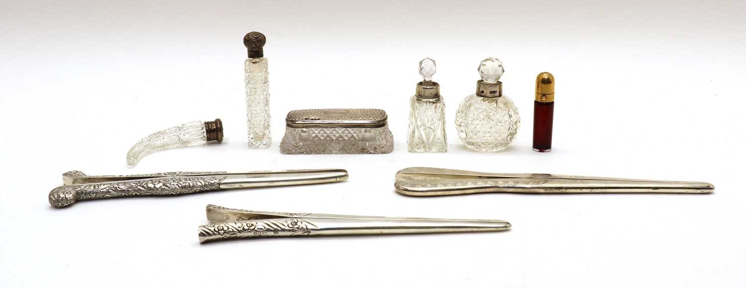 A group of three silver glove stretchers,