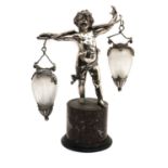 A silver-plated putto,