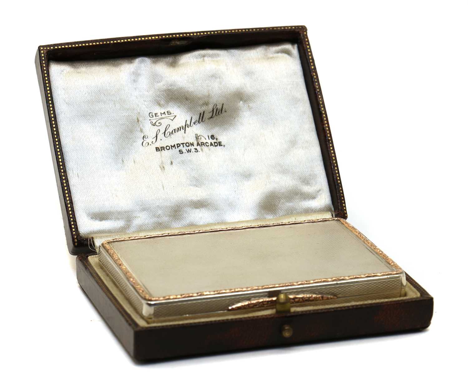 A silver card case,