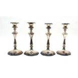 A set of four Victorian style silver plated candlesticks