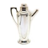 A silver-plated cocktail shaker,