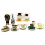 A collection of ten coffee cups and saucers,