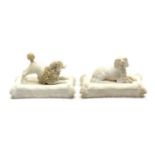 A pair of Mintons biscuit porcelain dogs,