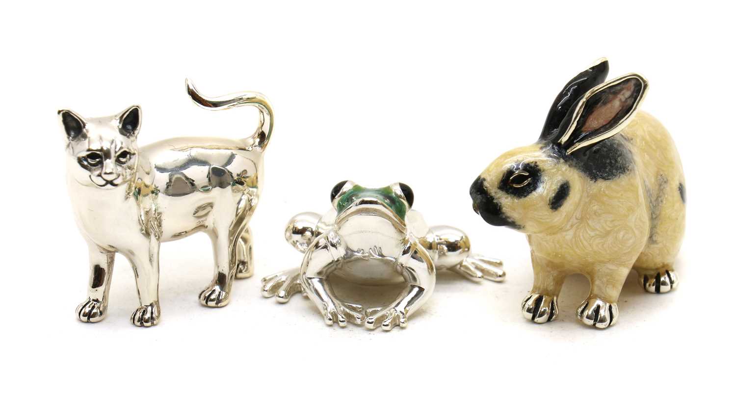 A collection of three novelty silver and enamel figures,