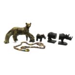 A collection of modern African tribal items and lion figures,