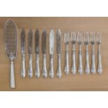 A Victorian set of six pairs of silver fish knives and forks