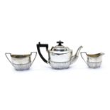 A silver three piece tea service