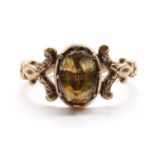 A gold single stone foiled topaz ring,