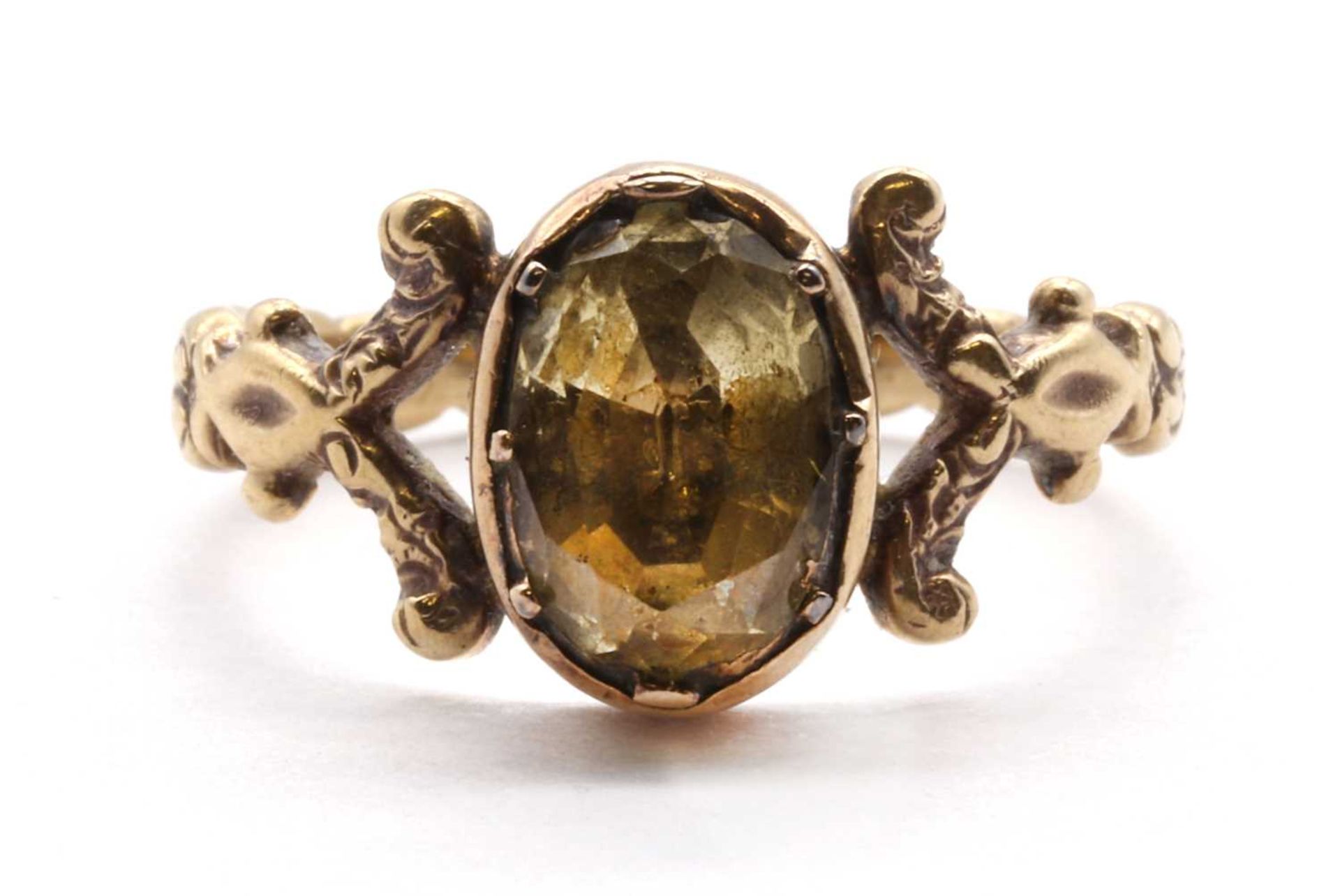 A gold single stone foiled topaz ring,