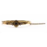 A gold sapphire, diamond and split pearl bangle,