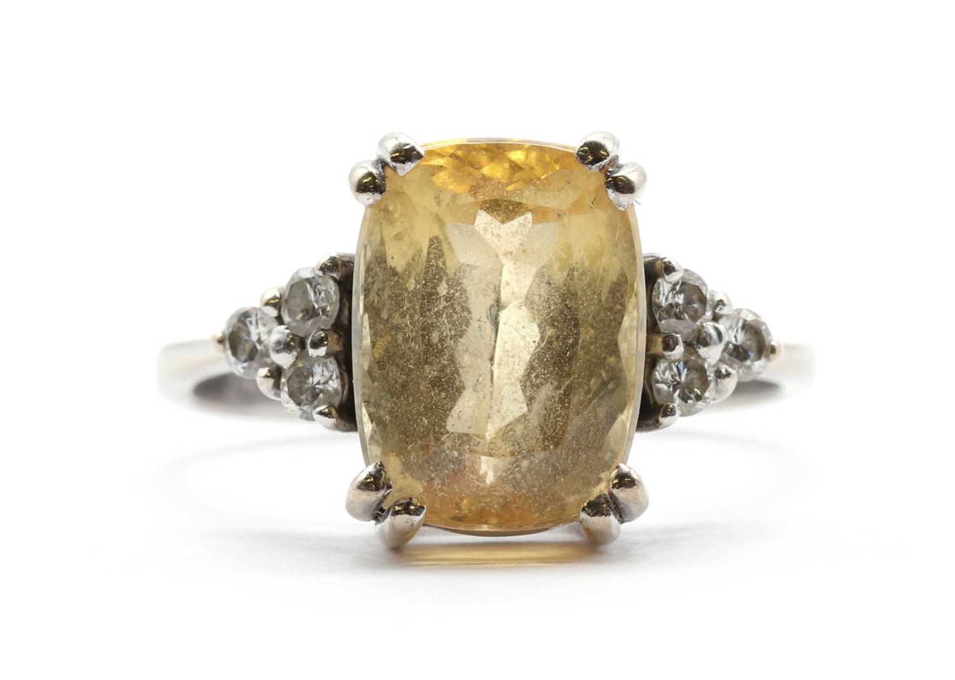 A white gold yellow topaz and diamond ring,