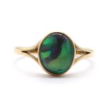 A gold single stone black opal ring,