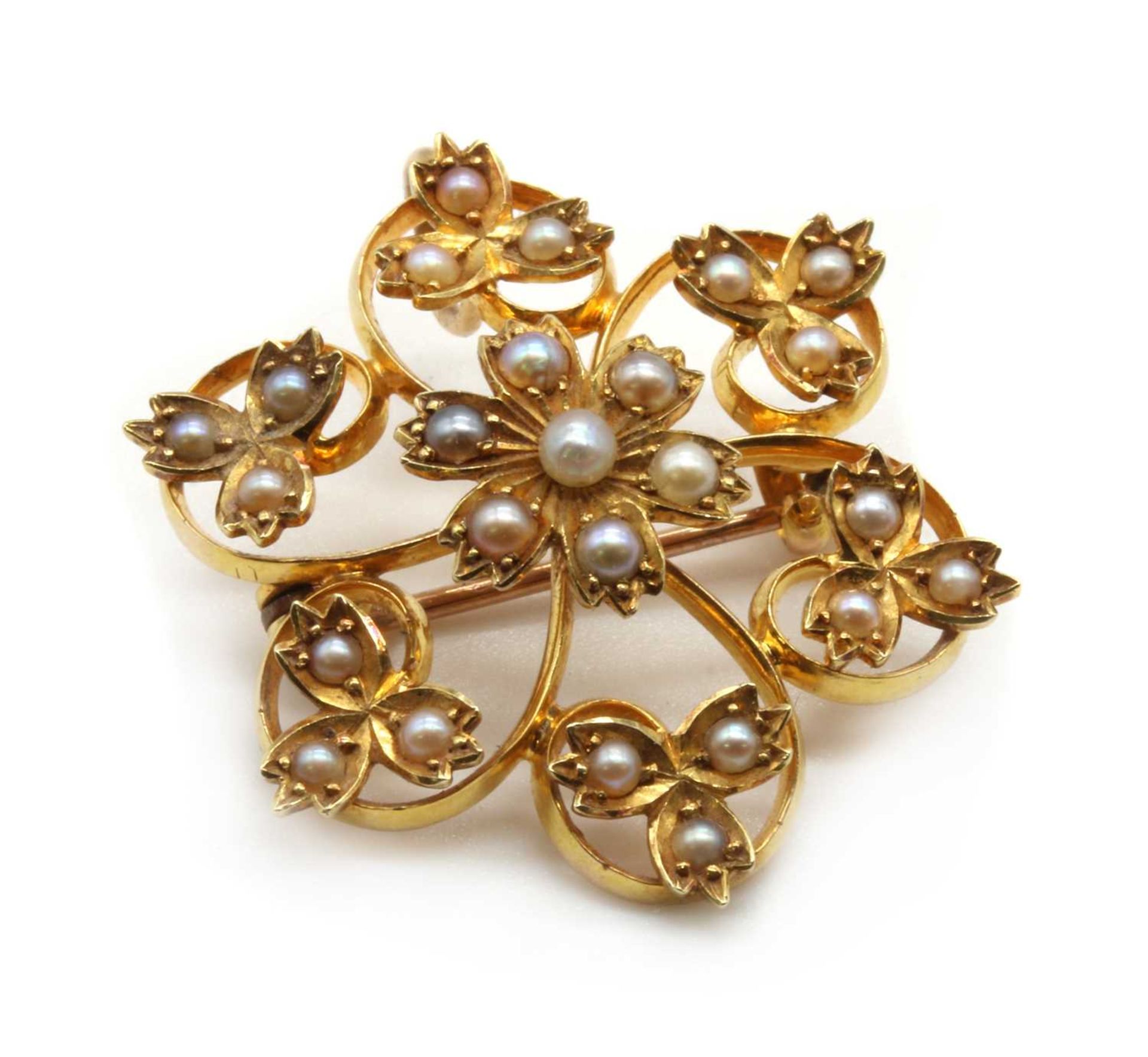 An Edwardian gold split pearl flower brooch/pendant,