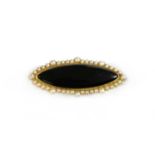 A Victorian gold onyx and split pearl brooch,