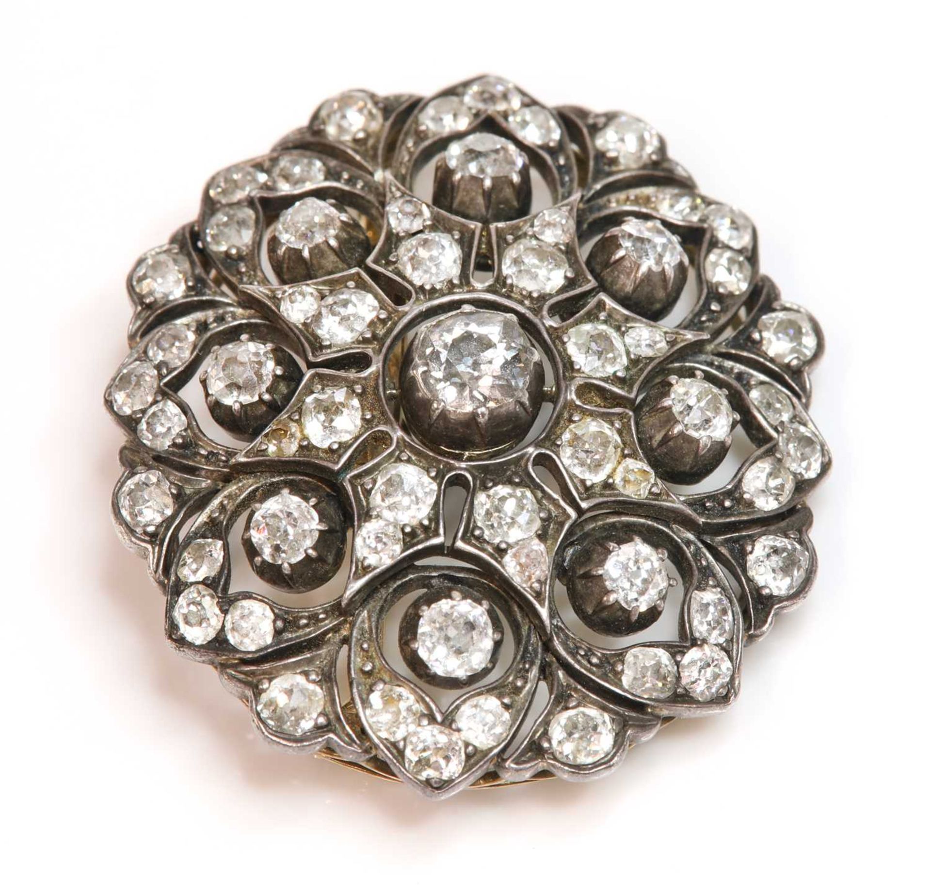 A Victorian diamond set oval cluster brooch/pendant, c.1880,