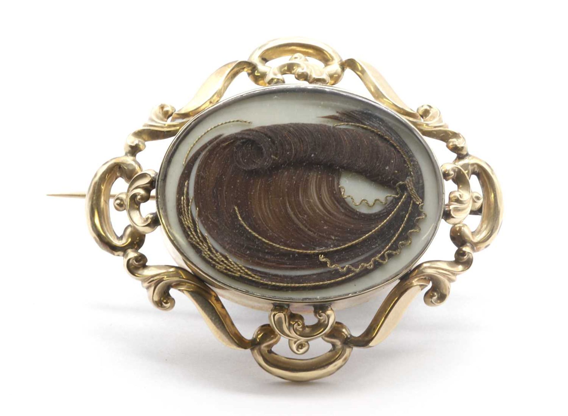 A Victorian gold memorial brooch,