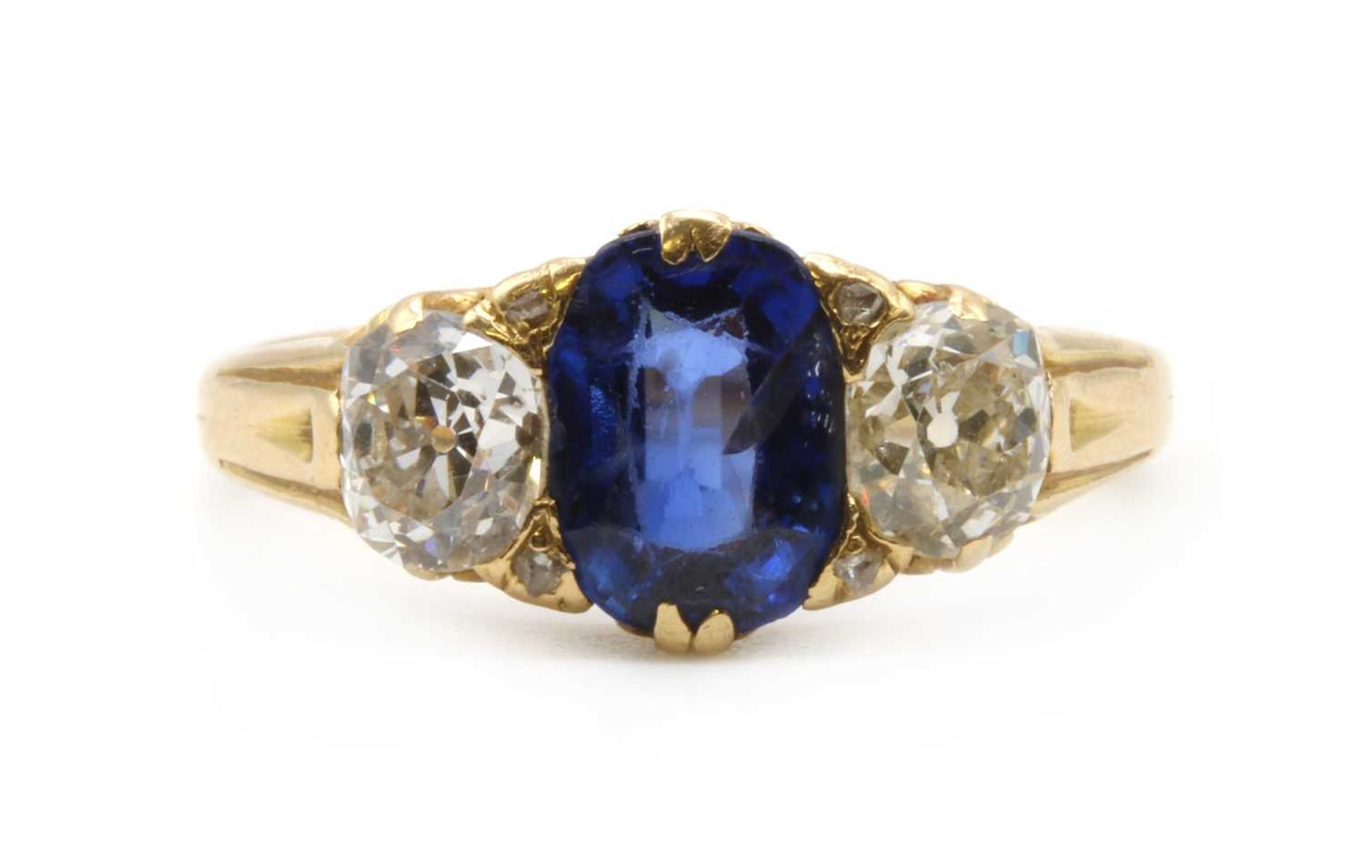 A gold sapphire and diamond three stone ring,