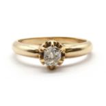 A gold single stone diamond ring,