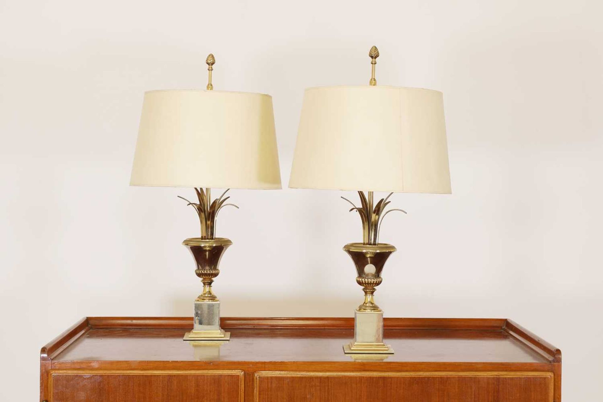 A pair of brass table lamps,