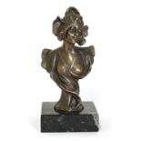 An Art Nouveau bronze bust of a lady,