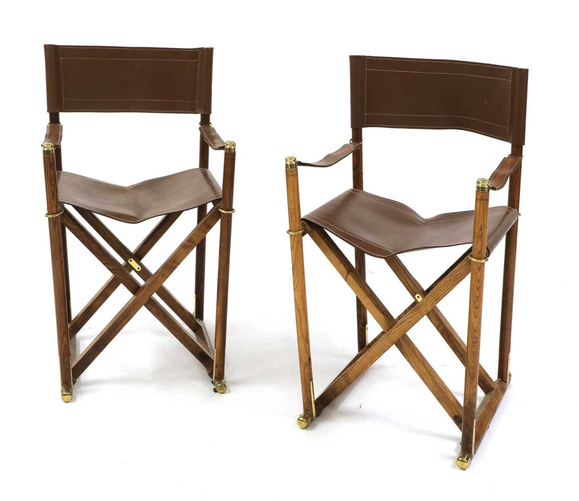 A pair of Spanish oak safari chairs,