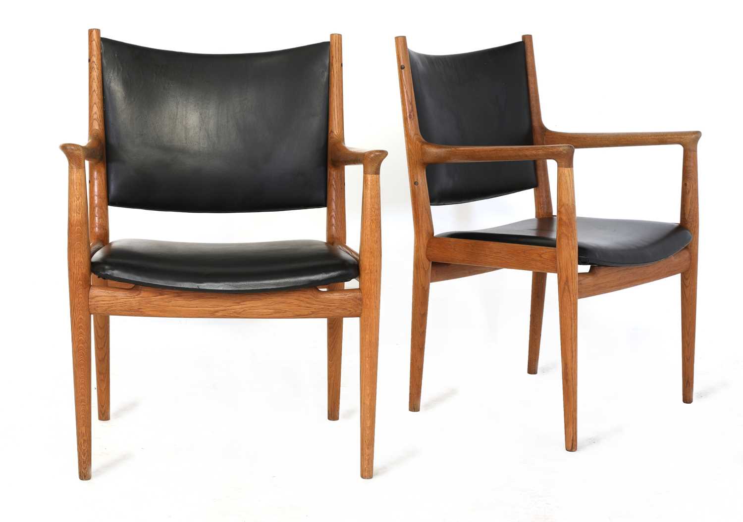 A pair of 'JH713' oak lounge chairs,