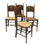 A set of four oak and rush-seated chairs,