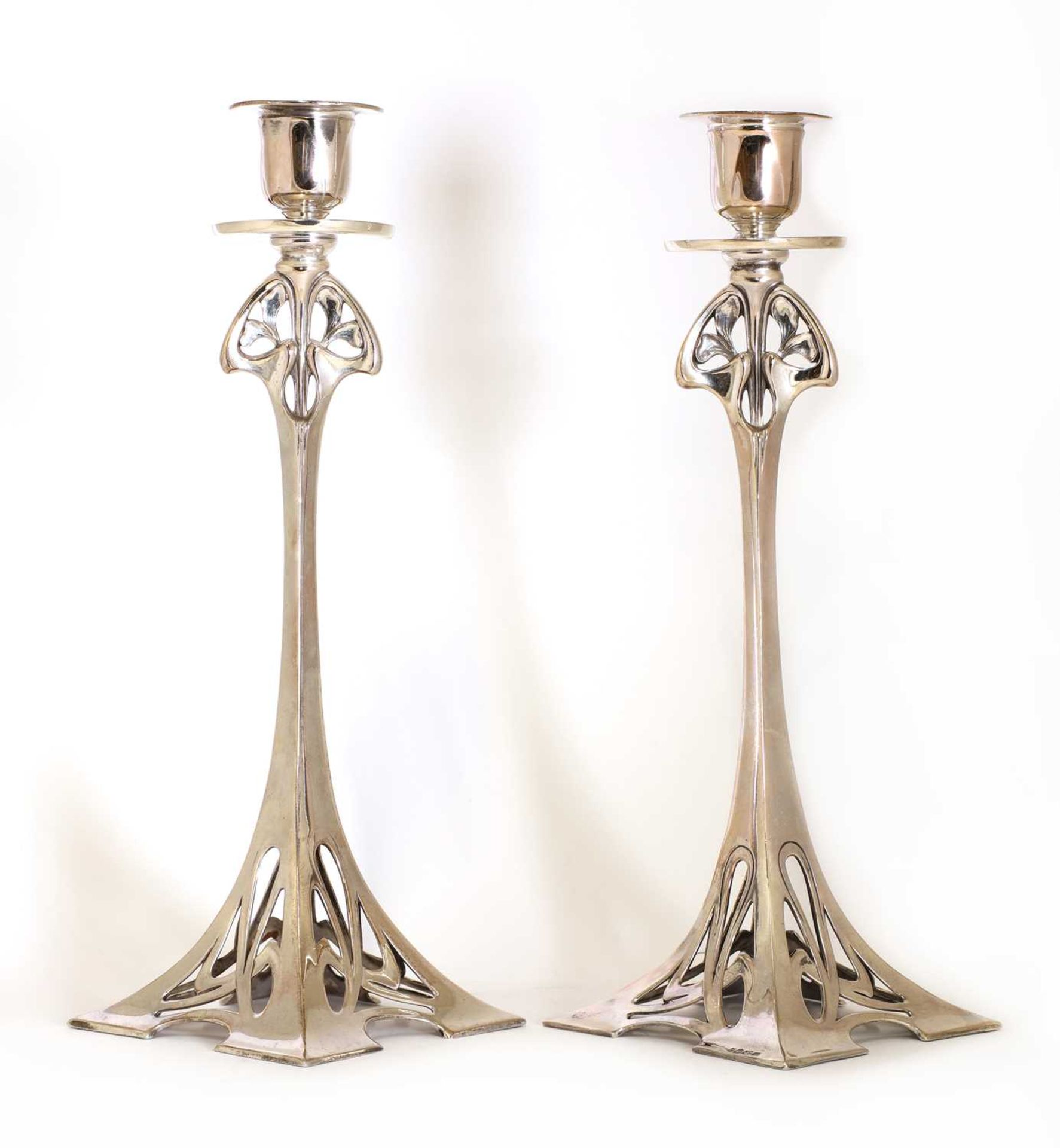 A pair of WMF silver-plated candlesticks,