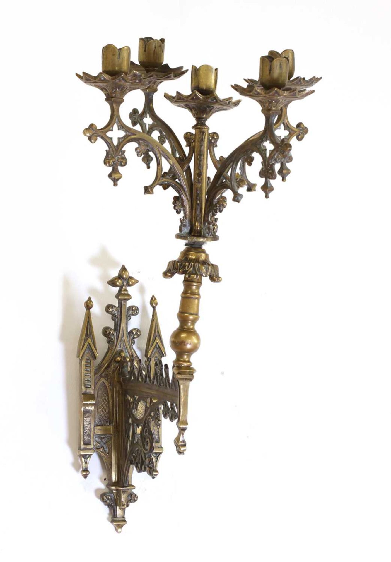 A Gothic brass wall light,