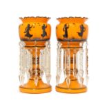 A pair of Continental orange glass table lustres,