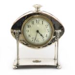 An Arts and Crafts silver-plated desk clock,