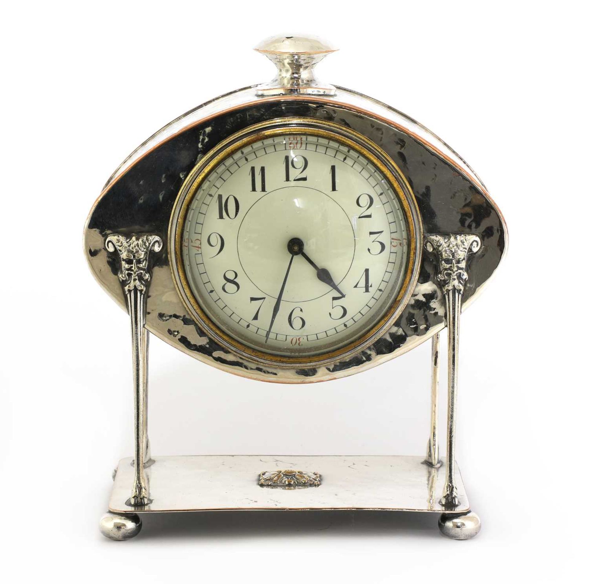 An Arts and Crafts silver-plated desk clock,