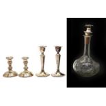 A pair of silver candlesticks,