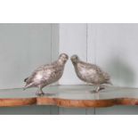 A pair of German metalware partridge,