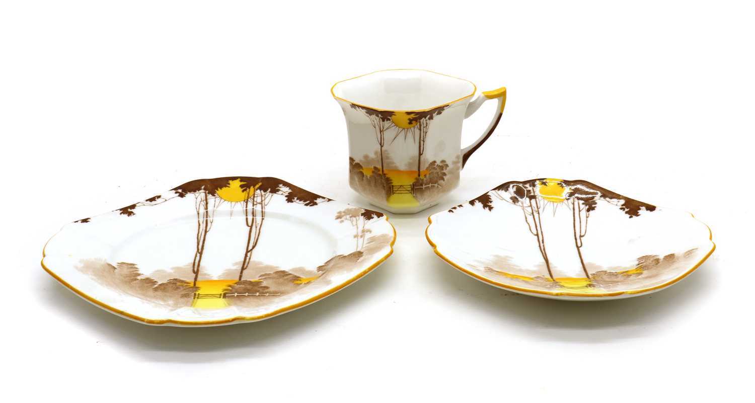 An Art Deco Shelley pottery 'Sunrise' pattern trio,