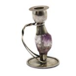 An Arts & Crafts style silver and amethyst candlestick,