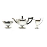 A silver three piece tea service