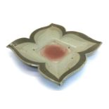 A stoneware flower form dish,