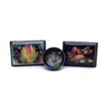 A William Moorcroft pottery 'Leaf and Berry' pattern lidded box,