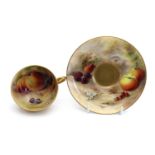 A Royal Worcester porcelain Fallen Fruits teacup and saucer