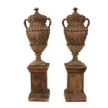 A pair of faux terracotta garden urns