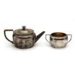A silver-plated teapot,