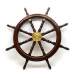A mahogany ships wheel,