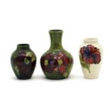 A small Moorcroft pottery 'Hibiscus' pattern vase,