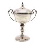 A silver presentation cup and cover